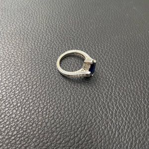 Sterling silver ring with some sort of crystals in the sides.